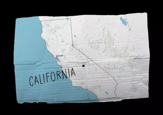 Image of map of California on a crumpled cardboard sign
