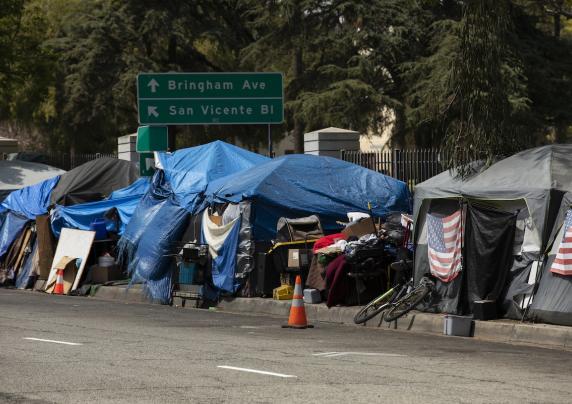 Tents line a sidewalk