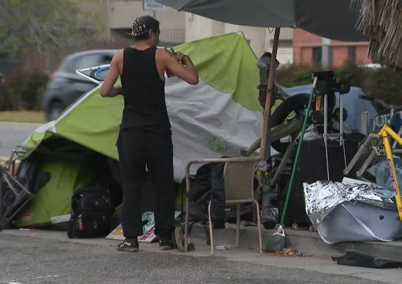 Man stands near tent