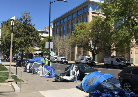 tents line a sidewalk