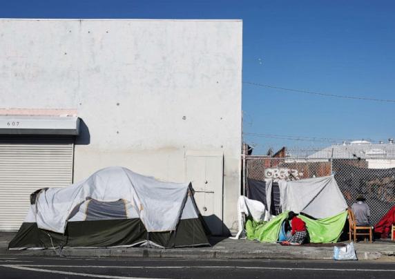 a homeless encampment on the side of the street.