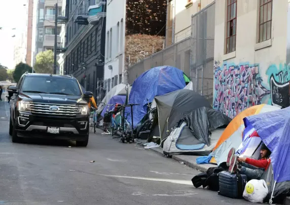 Tents next to a city street