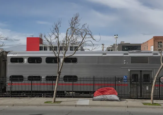 Tent near parked commuter train