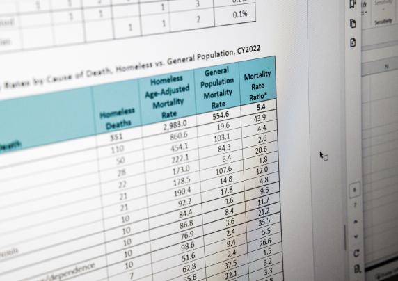 Photo of statistics on homeless mortality on a computer