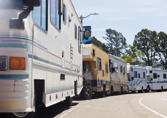 Several RVs parked along a street