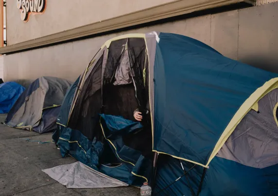 Tents line a sidewalk