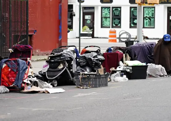 Person and belongings on a city street