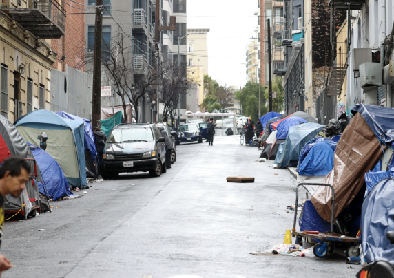 Homeless tent lining a street