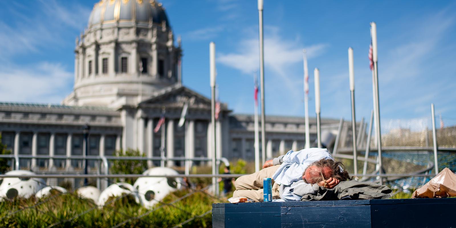 Man sleeping outside city hall