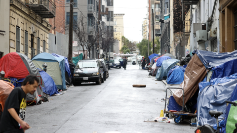 Homeless tent lining a street