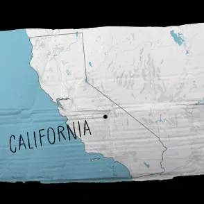 Image of map of California on a crumpled cardboard sign